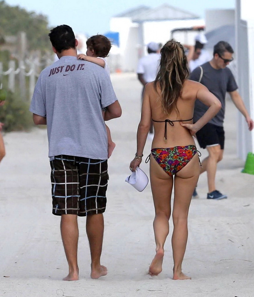 Molly Sims wearing a colorful bikini on a beach in Miami #75209242