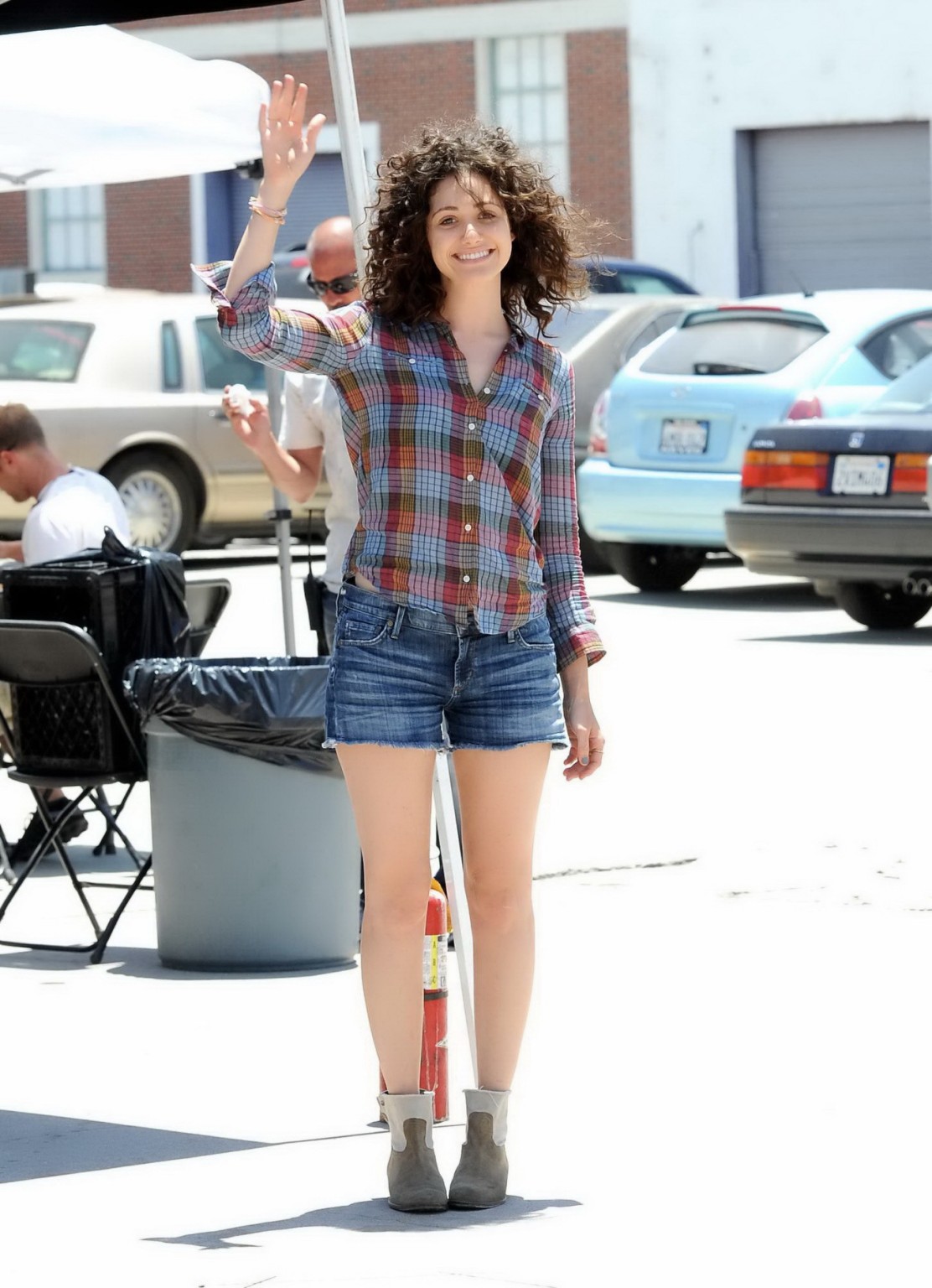Emmy Rossum wearing denim shorts and some crazy hair on the set of Comet in LA #75228307