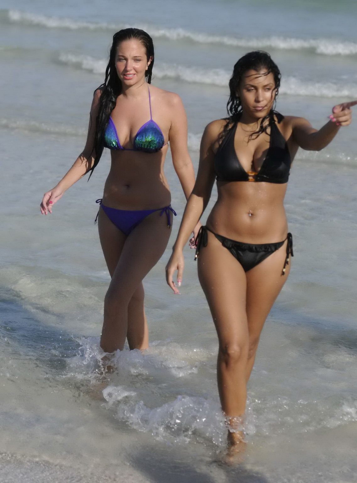 Tulisa Contostavlos showing off her curvy body in a tiny purple bikini at the be #75171041