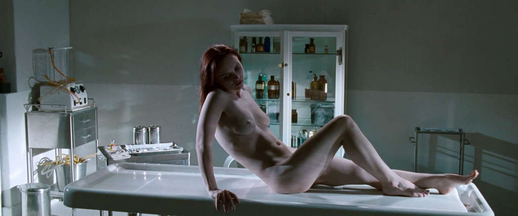 Christina Ricci reveals her nice small tits while lie on desk in movie #75338371