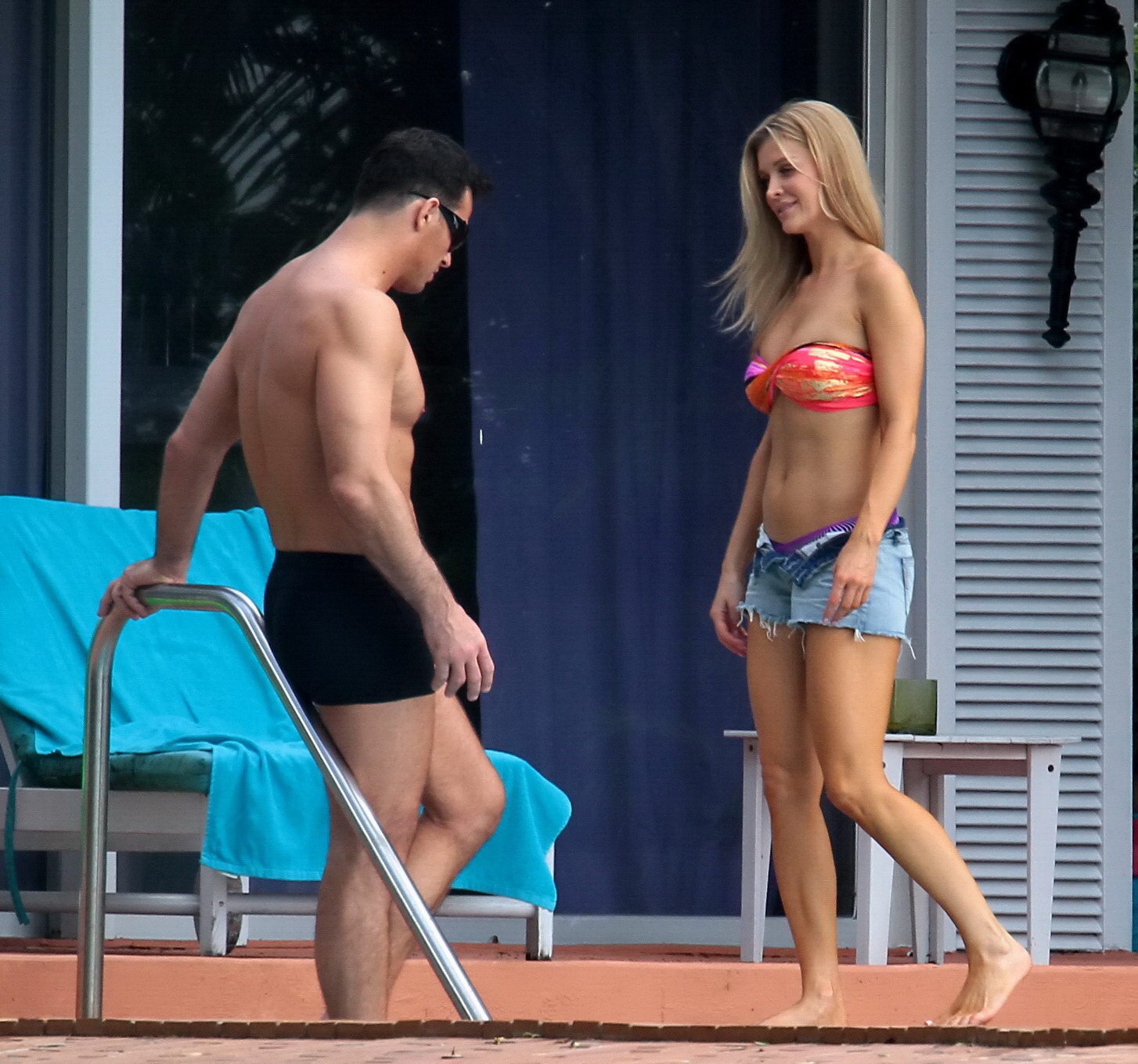 Joanna Krupa wearing a strapless bikini top and hotpants poolside in Miami #75207334