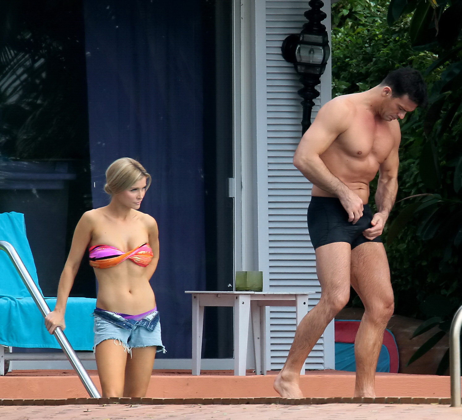 Joanna Krupa wearing a strapless bikini top and hotpants poolside in Miami #75207381