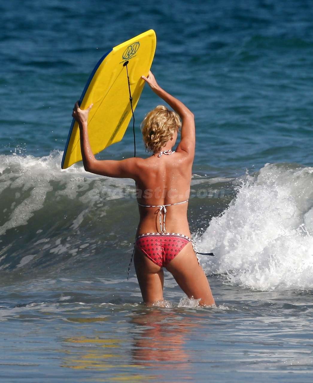 Charlize Theron enjoy playing in bikini on beach paparazzi pictures #75297194