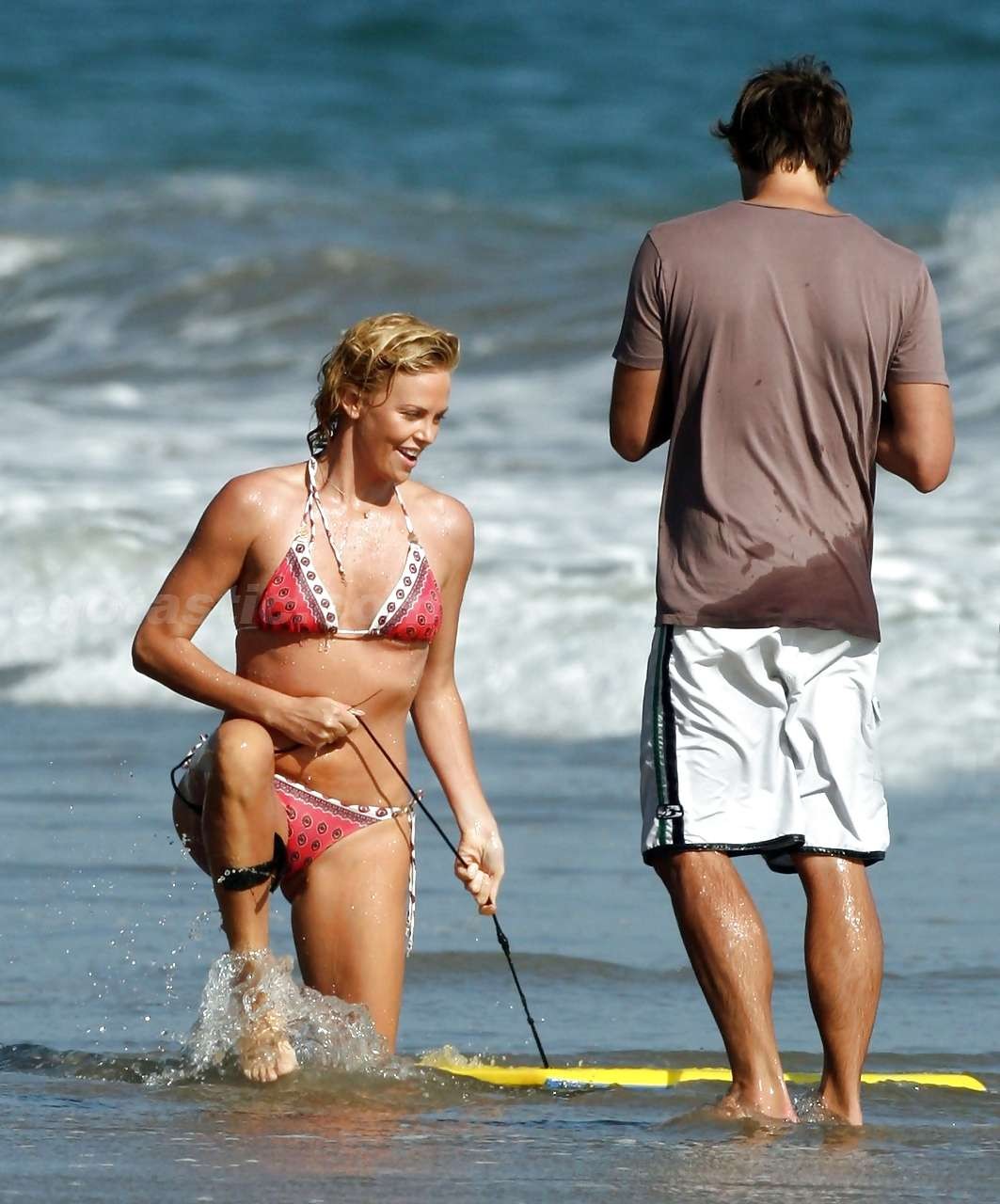 Charlize Theron enjoy playing in bikini on beach paparazzi pictures #75297209