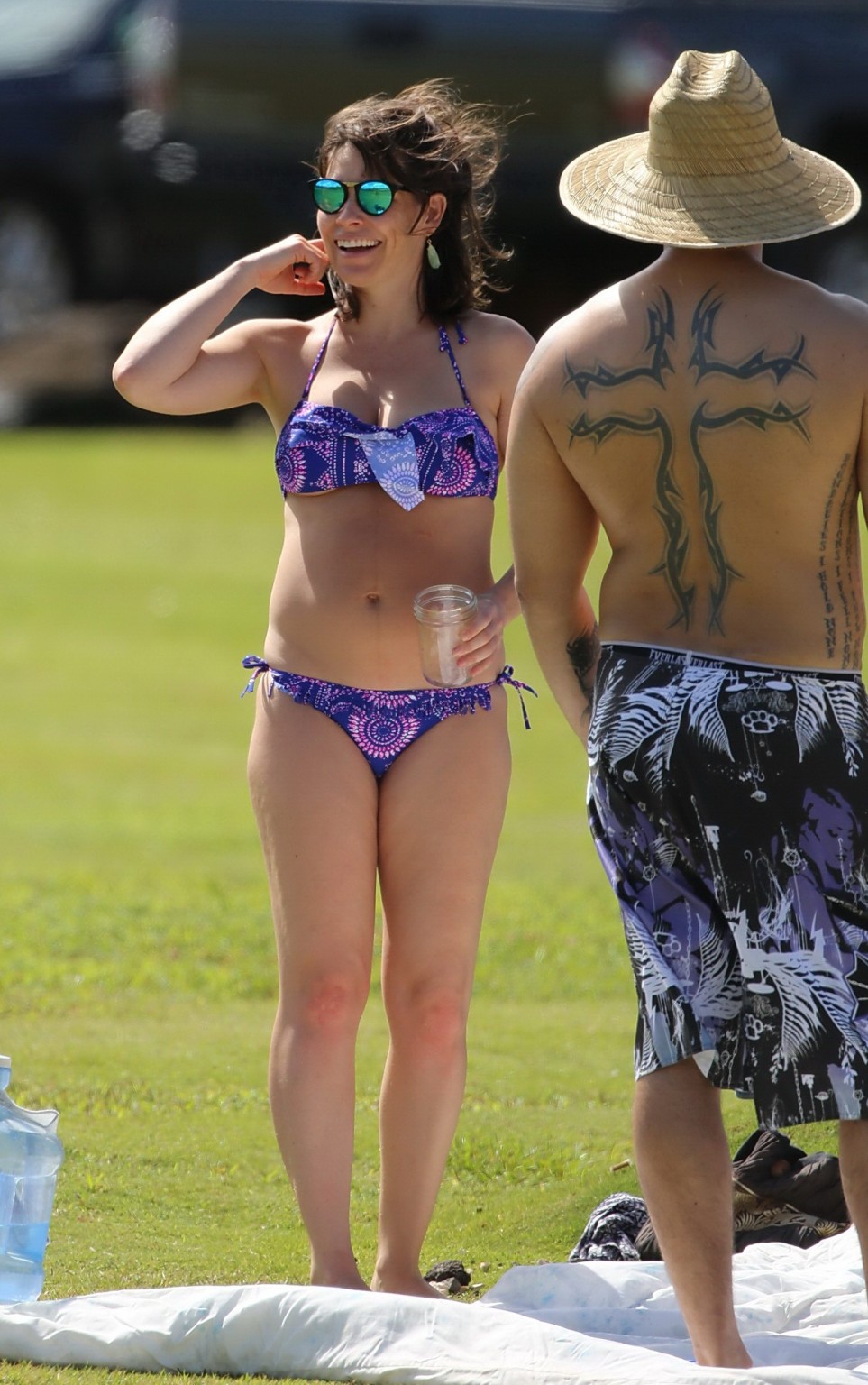 Evangeline Lilly showing underboobs in purple bikini #75150740