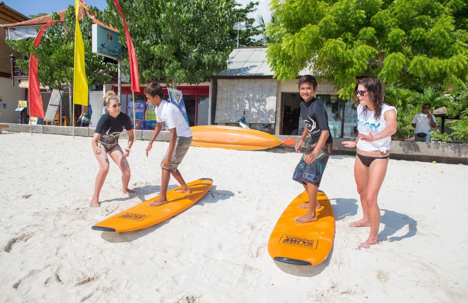 Ashley Greene wearing black bikini while surfing at the Oakley Learn To Surf Eve #75228315