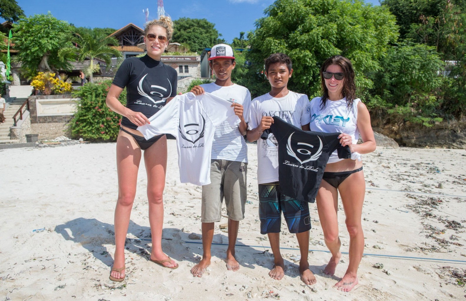 Ashley Greene wearing black bikini while surfing at the Oakley Learn To Surf Eve #75228323