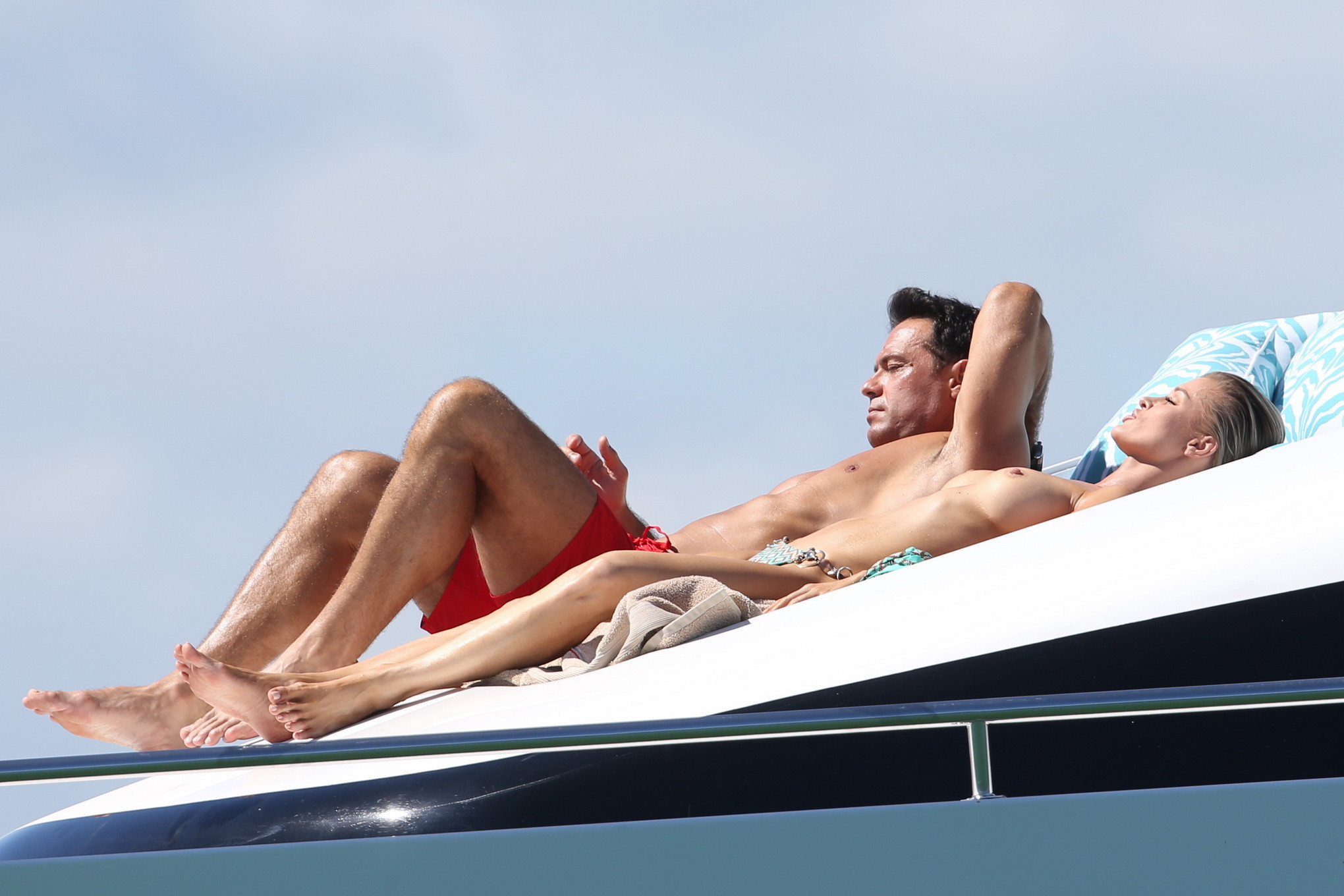 Joanna Krupa tanning topless at the yacht in Miami