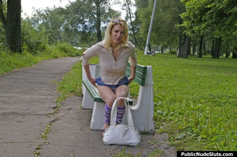 Impudent slut rubbing her cunt with vibrator on the bench in the park #76742345