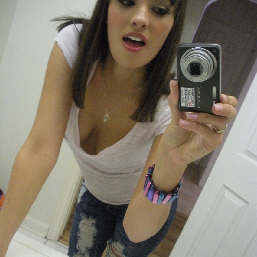 Brunette teen girlfriend posing in the mirror
