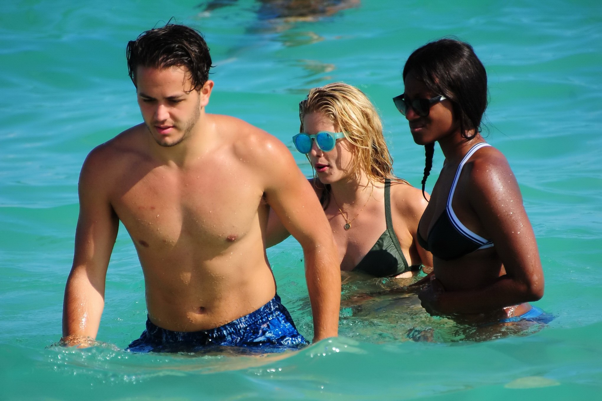 Emily Bett Rickards wearing tiny green bikini at the beach #75147994