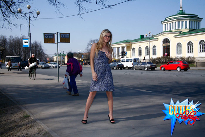 Fresh blonde teen poses topless on a busy street #71556169