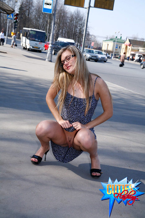 Fresh blonde teen poses topless on a busy street #71556177