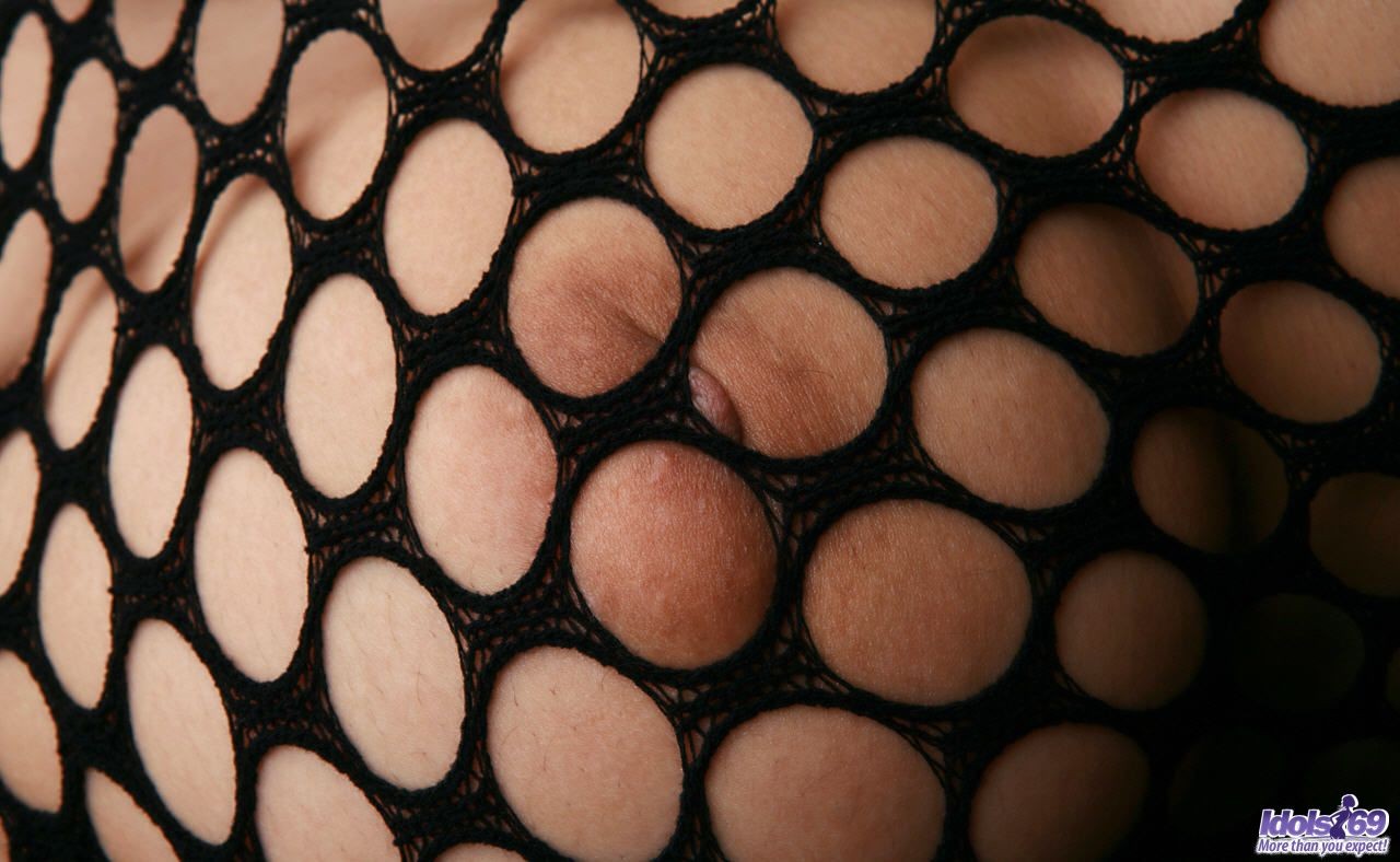 A skinny Japanese woman in a fishnet body stocking #69975328