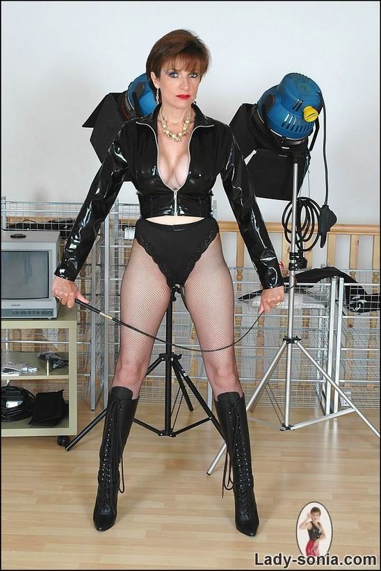 mature dominatrix posing in latex #72216474