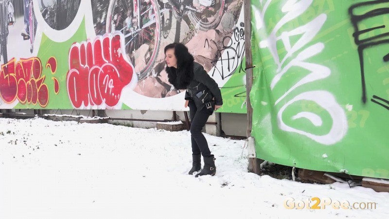 Pretty dark haired girl melts snow as she pees #67122392