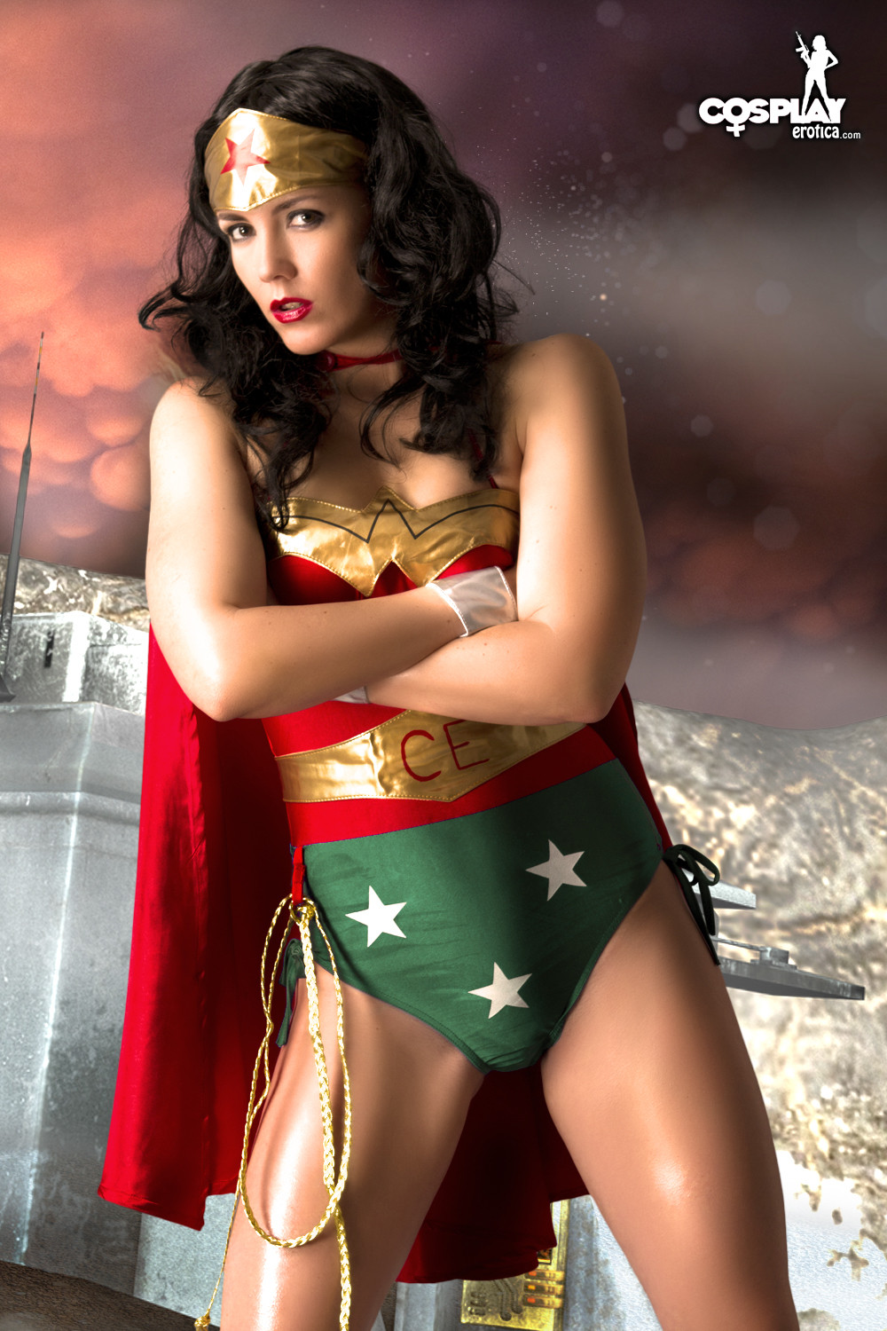 Enticing girl dressed as Wonder Woman strips naked