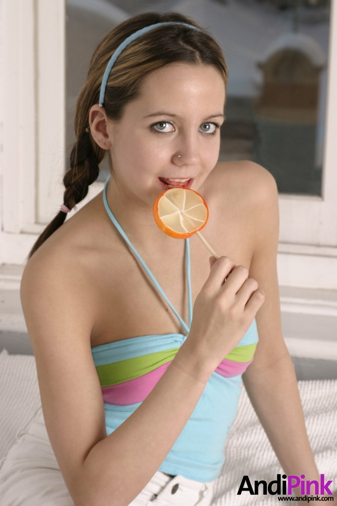 Cute teen girl licks lollypop #67551858