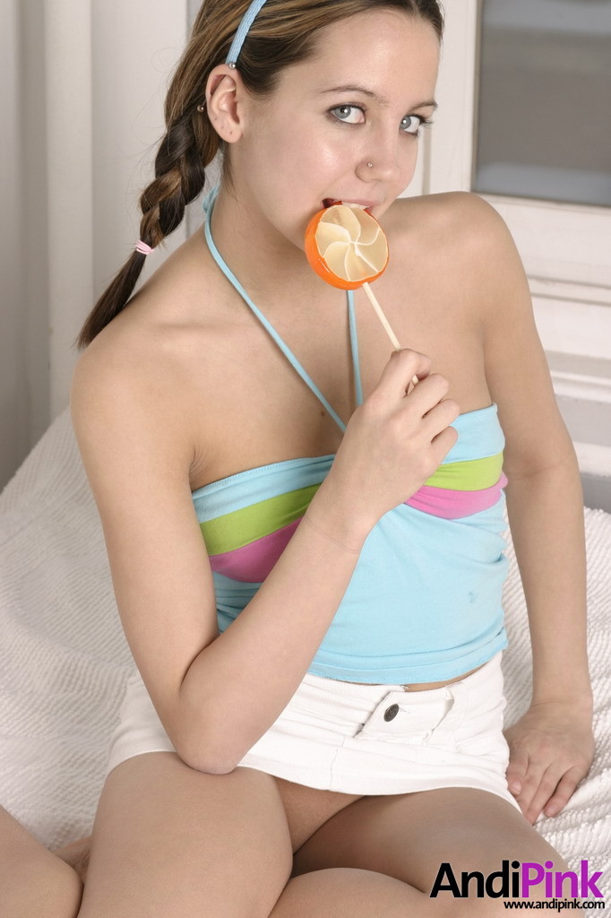 Cute teen girl licks lollypop #67551877