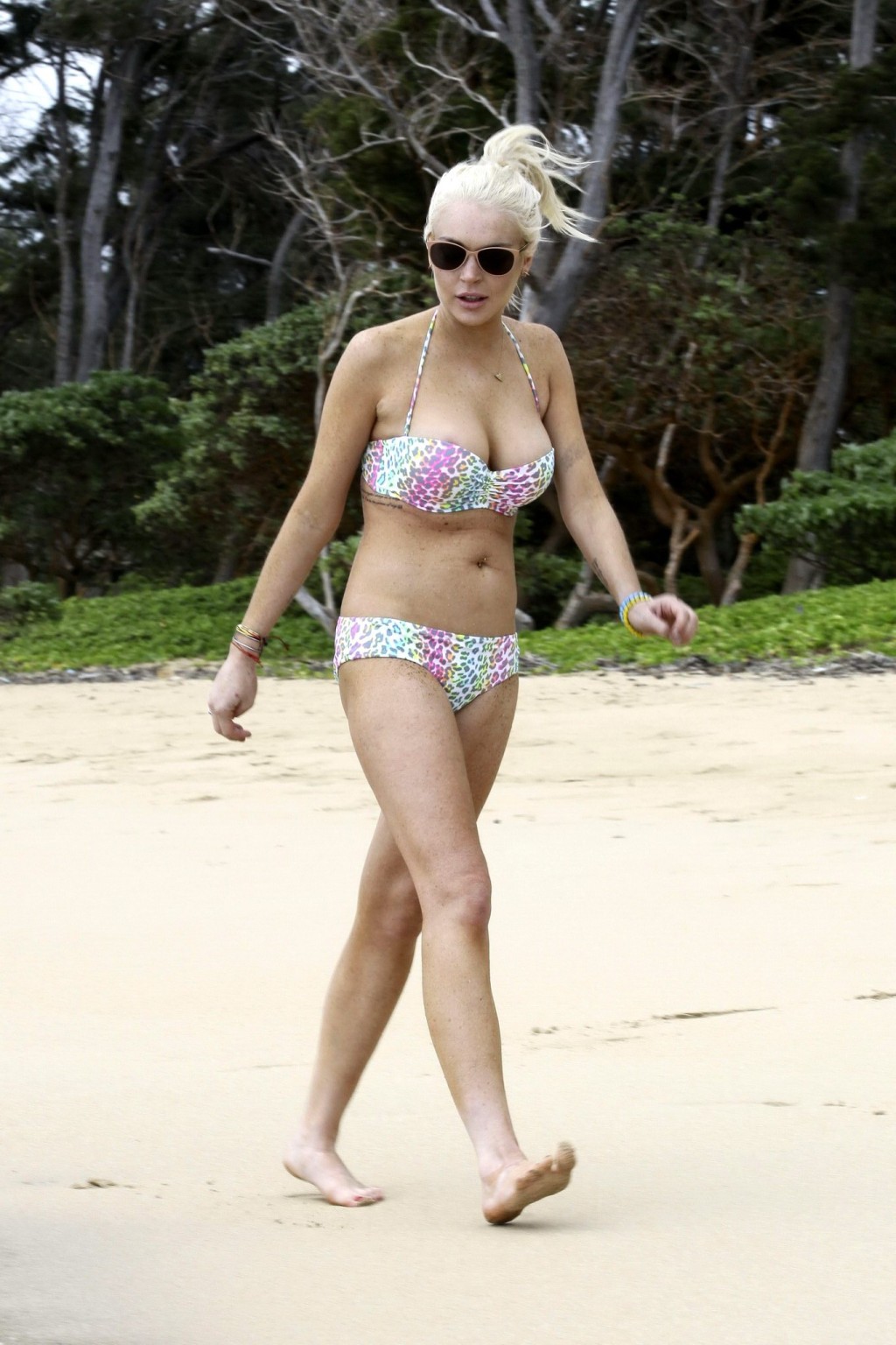 Lindsay Lohan bikini nip slip on a beach in Hawaii