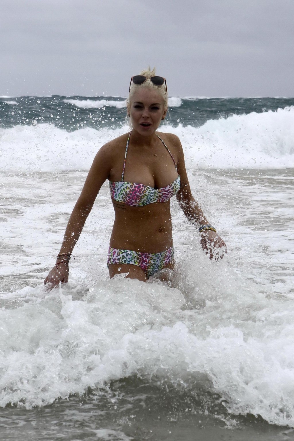 Lindsay Lohan bikini nip slip on a beach in Hawaii #75279327