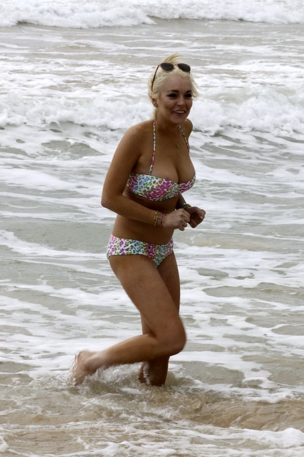 Lindsay Lohan bikini nip slip on a beach in Hawaii #75279348