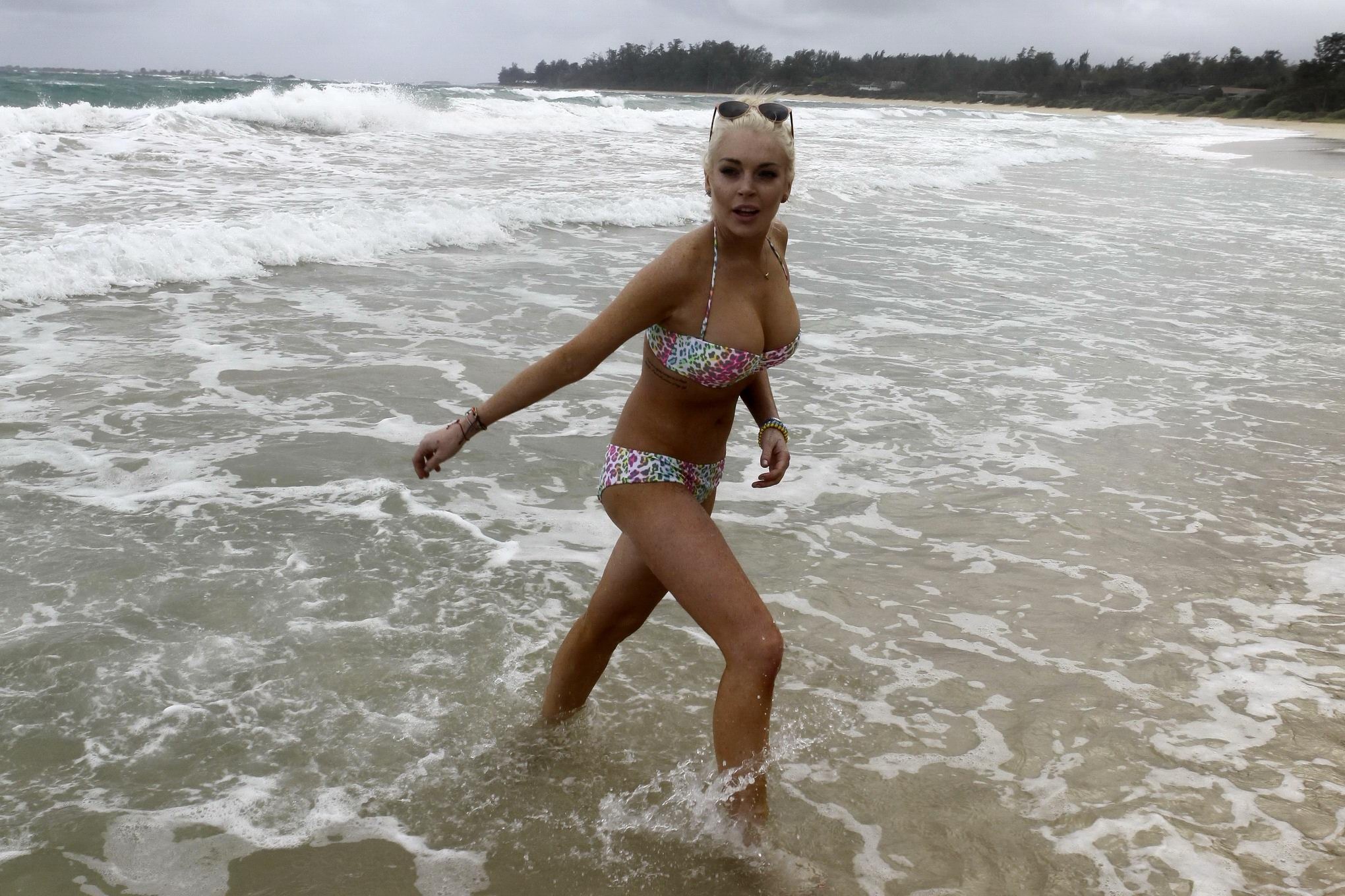 Lindsay Lohan bikini nip slip on a beach in Hawaii #75279363