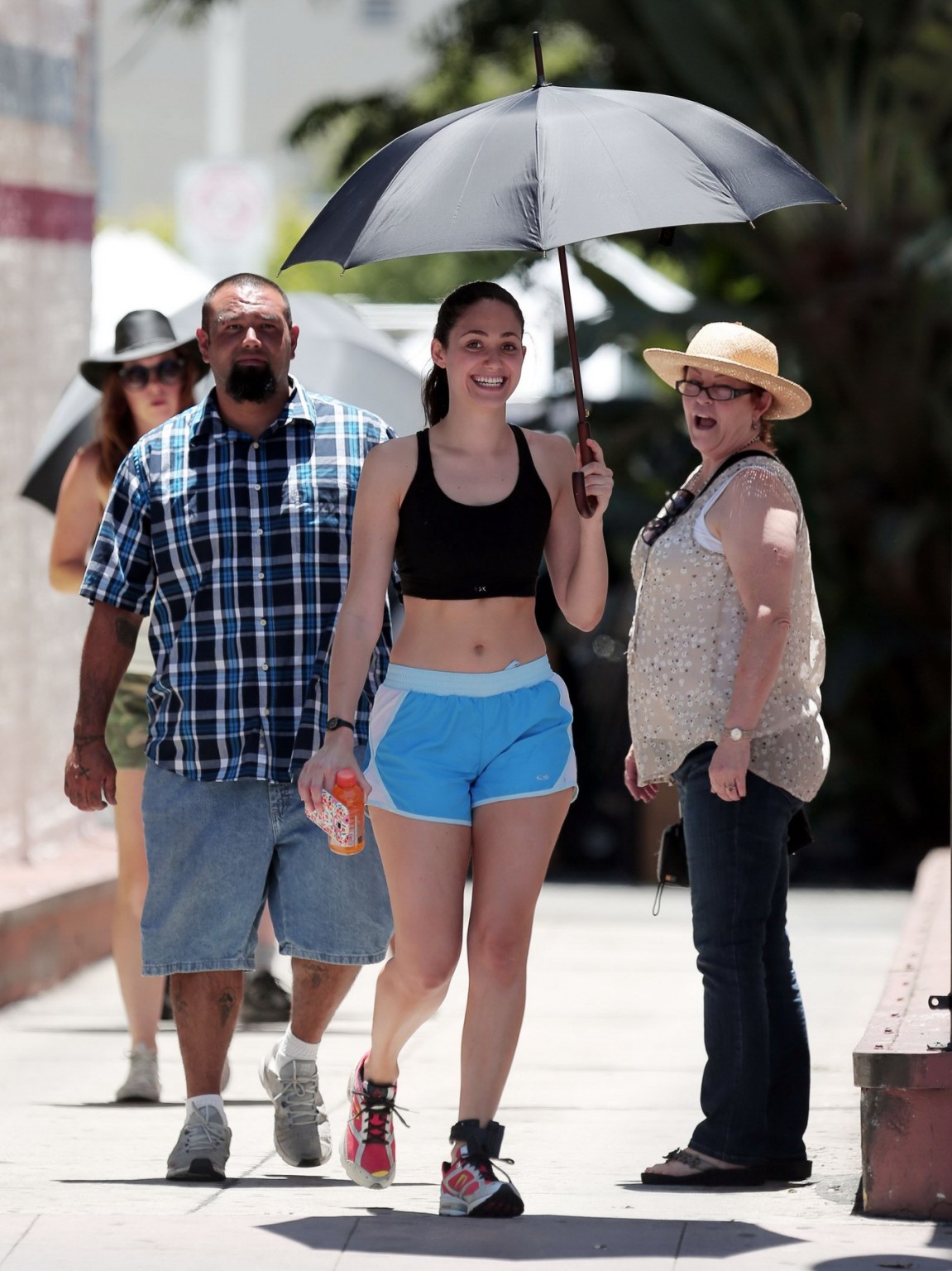 Emmy Rossum wearing black sport bra and shorts on the set of Shameless in Los An #75191113