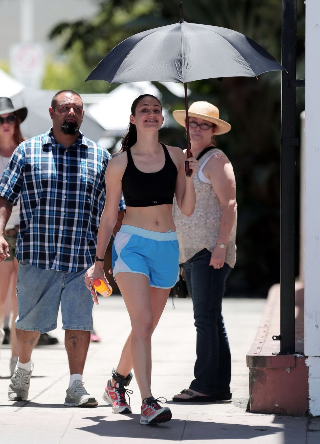 Emmy Rossum wearing black sport bra and shorts on the set of Shameless in Los An #75191125