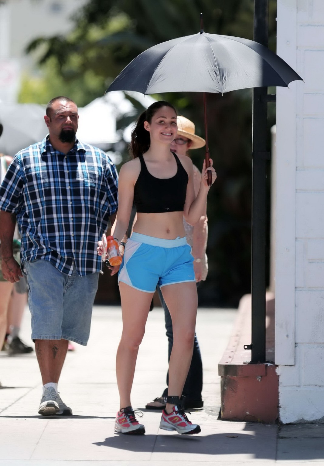 Emmy Rossum wearing black sport bra and shorts on the set of Shameless in Los An #75191134