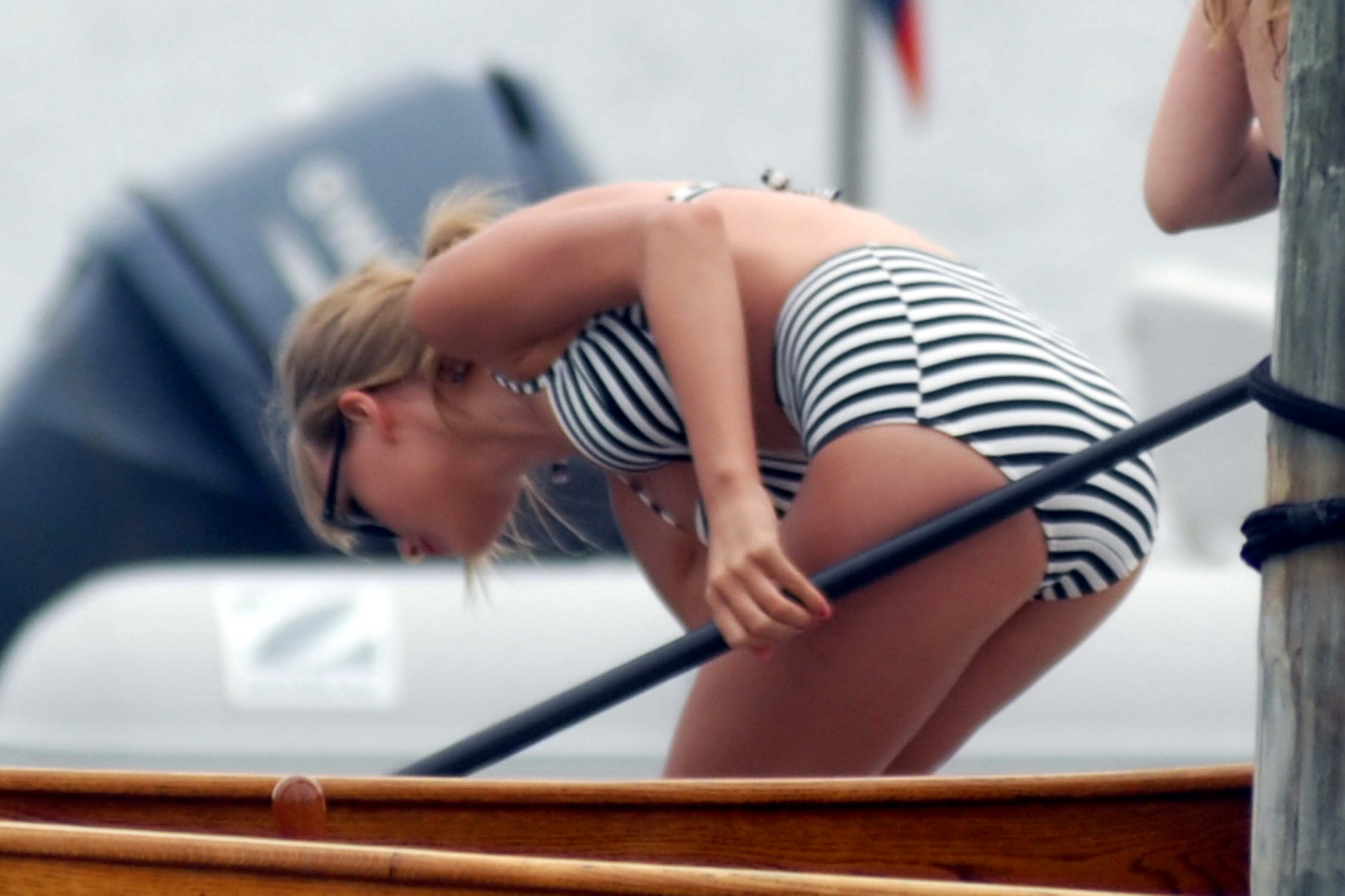 Taylor Swift in striped granny bikini paddleboarding in Westerly, Massachusetts #75223205