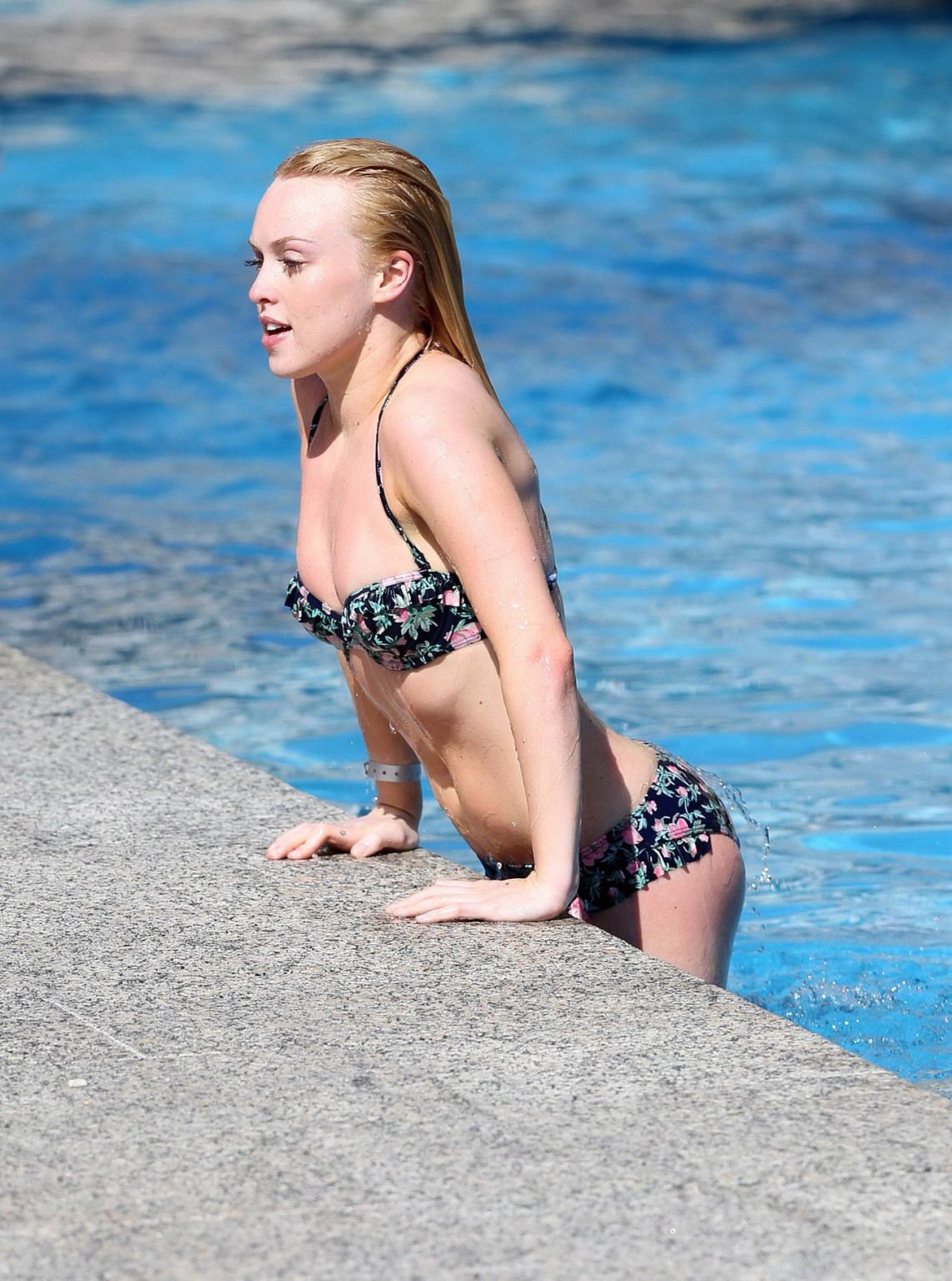 Jorgie Porter showing off her hot body in a skimpy floral bikini at the beach in #75172545