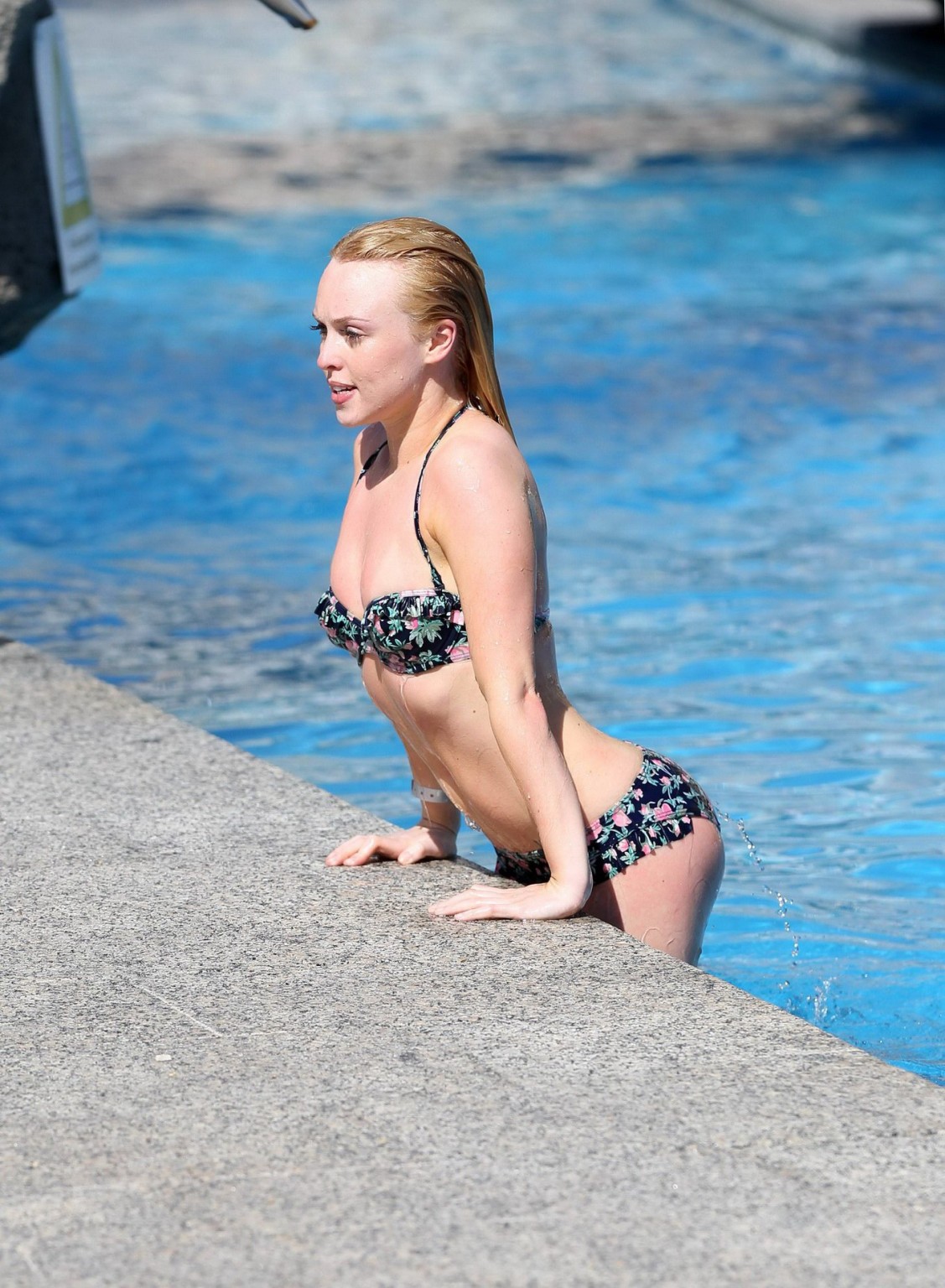 Jorgie Porter showing off her hot body in a skimpy floral bikini at the beach in #75172555