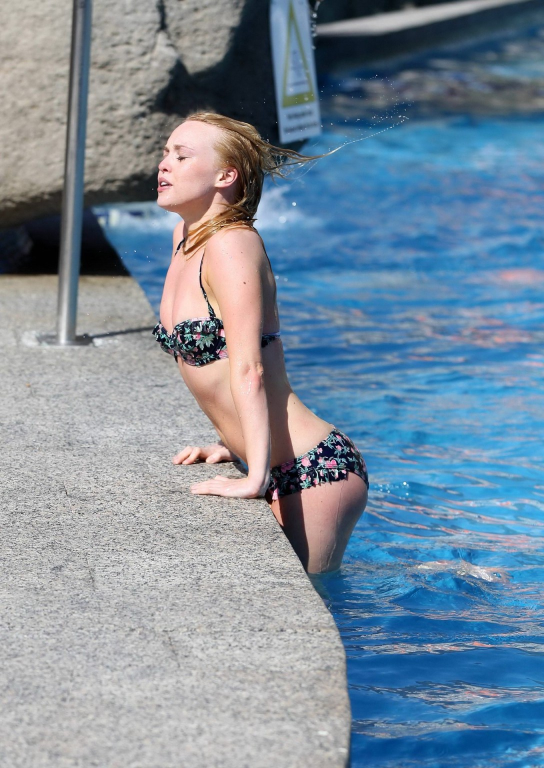 Jorgie Porter showing off her hot body in a skimpy floral bikini at the beach in #75172569
