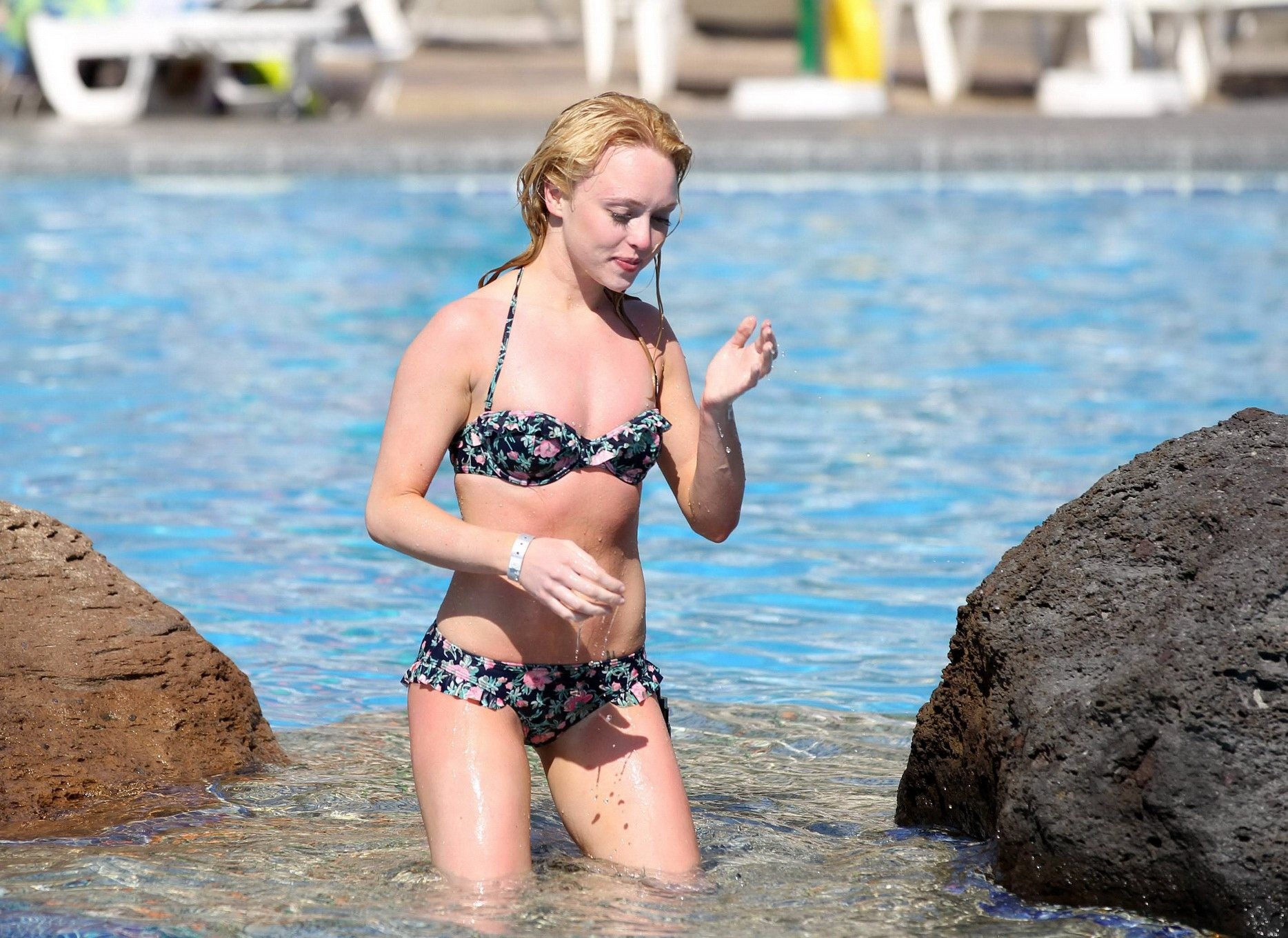 Jorgie Porter showing off her hot body in a skimpy floral bikini at the beach in #75172600