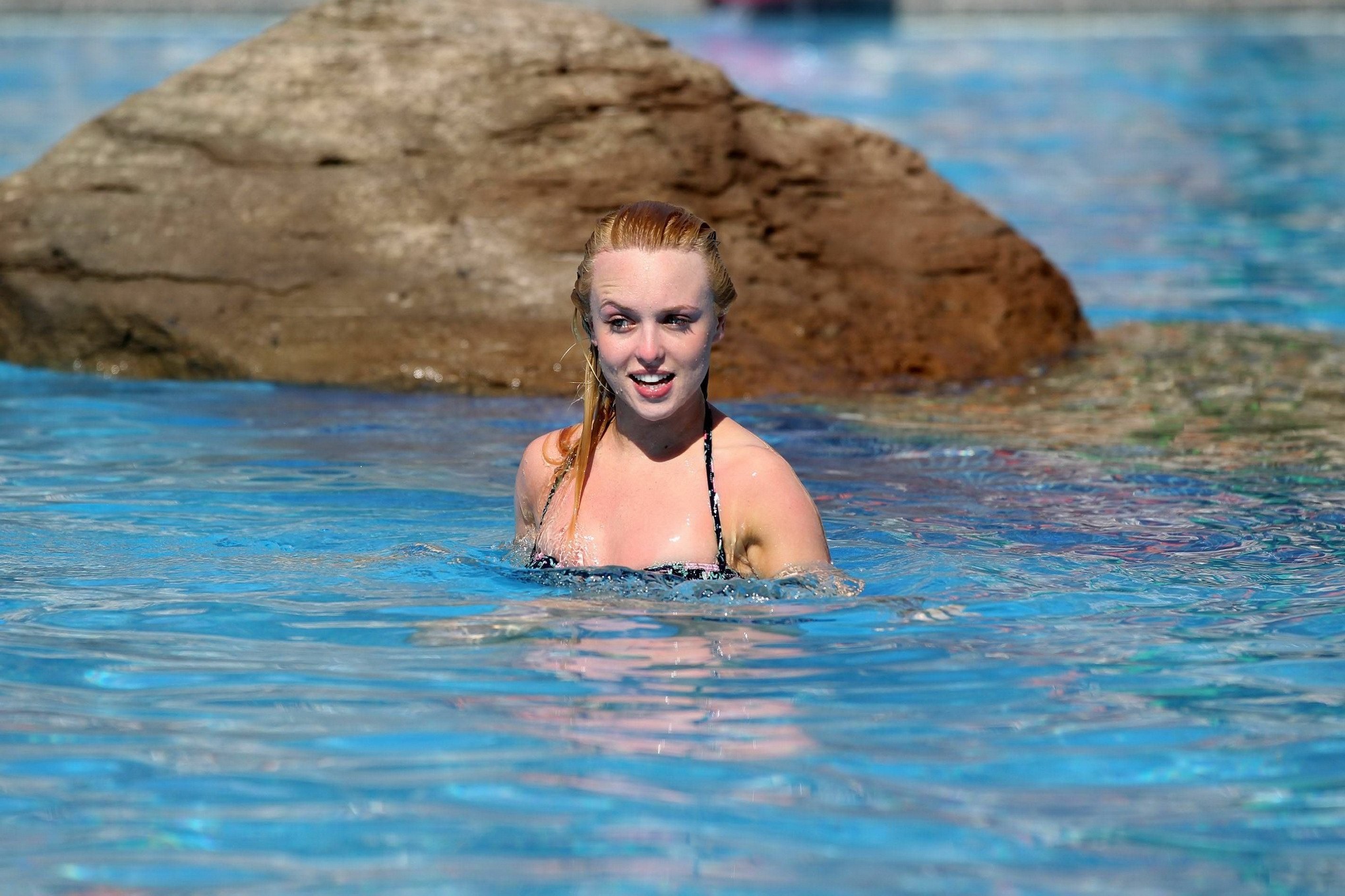 Jorgie Porter showing off her hot body in a skimpy floral bikini at the beach in #75172654