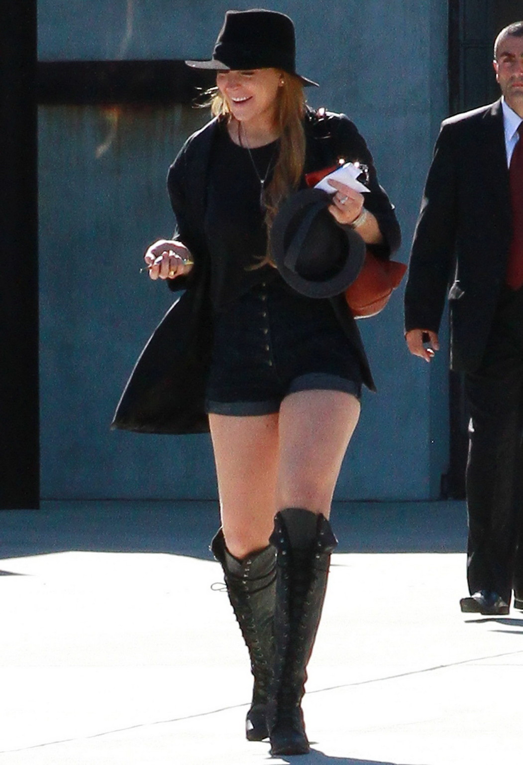 Lindsay Lohan braless wearing see through top, denim shorts  knee high boots at  #75332865