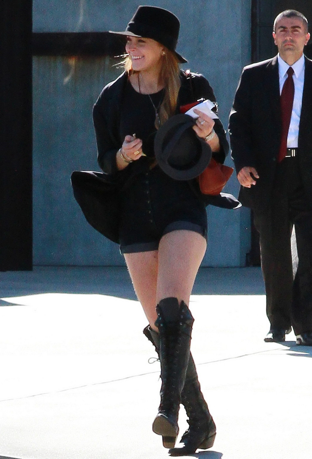 Lindsay Lohan braless wearing see through top, denim shorts  knee high boots at  #75332870