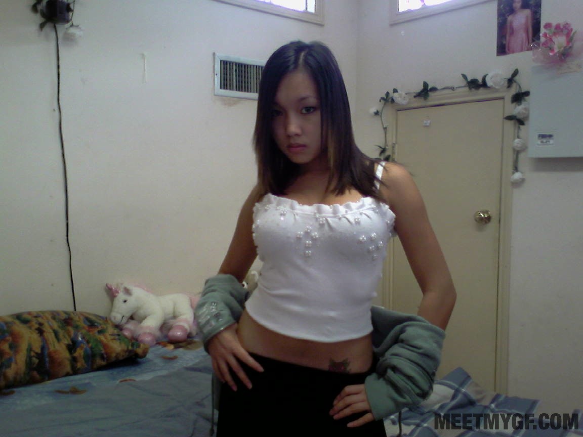 Teen Asian babe shows off big tits