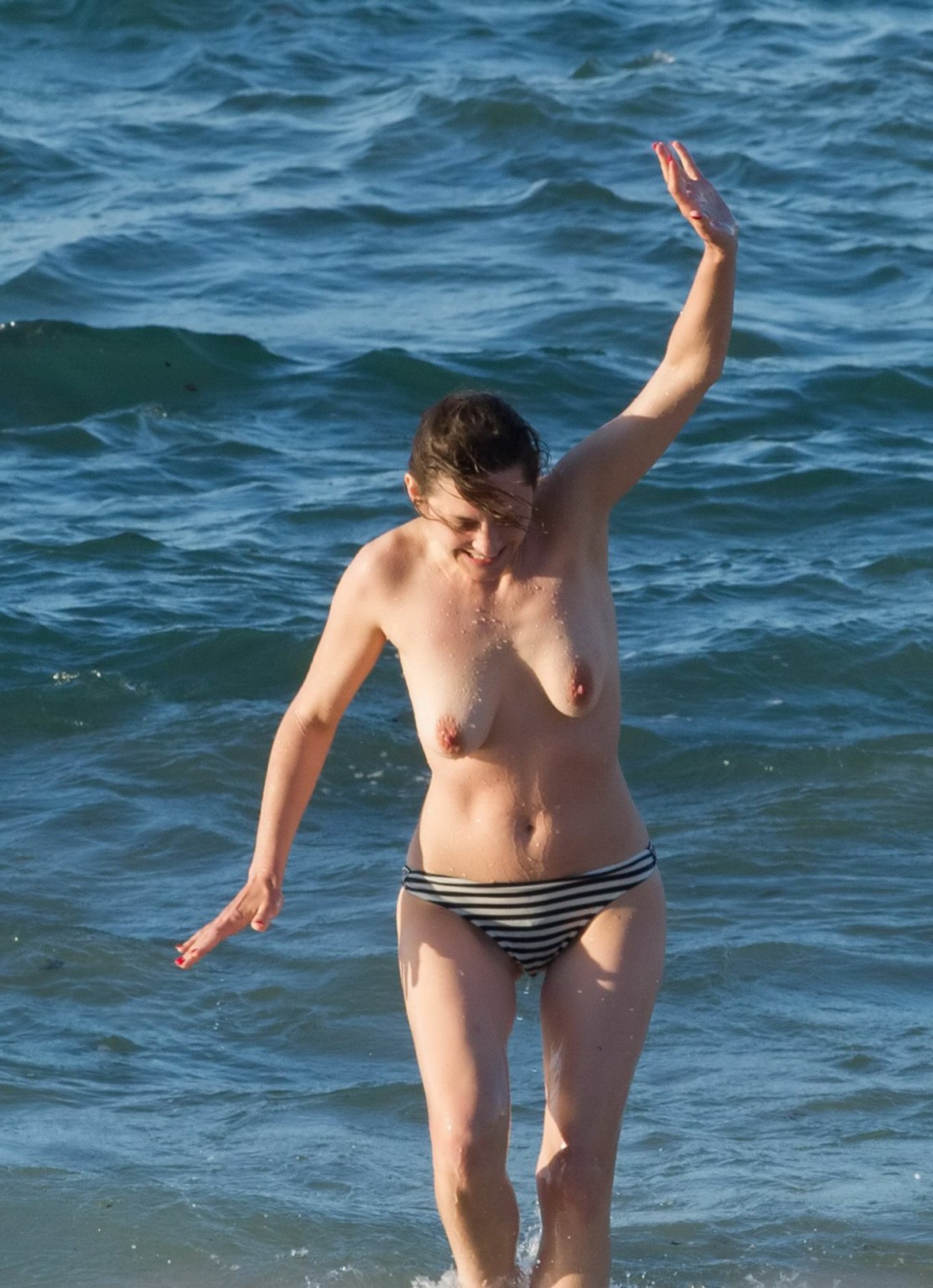 Marion Cotillard swimming topless at the beach #75141740