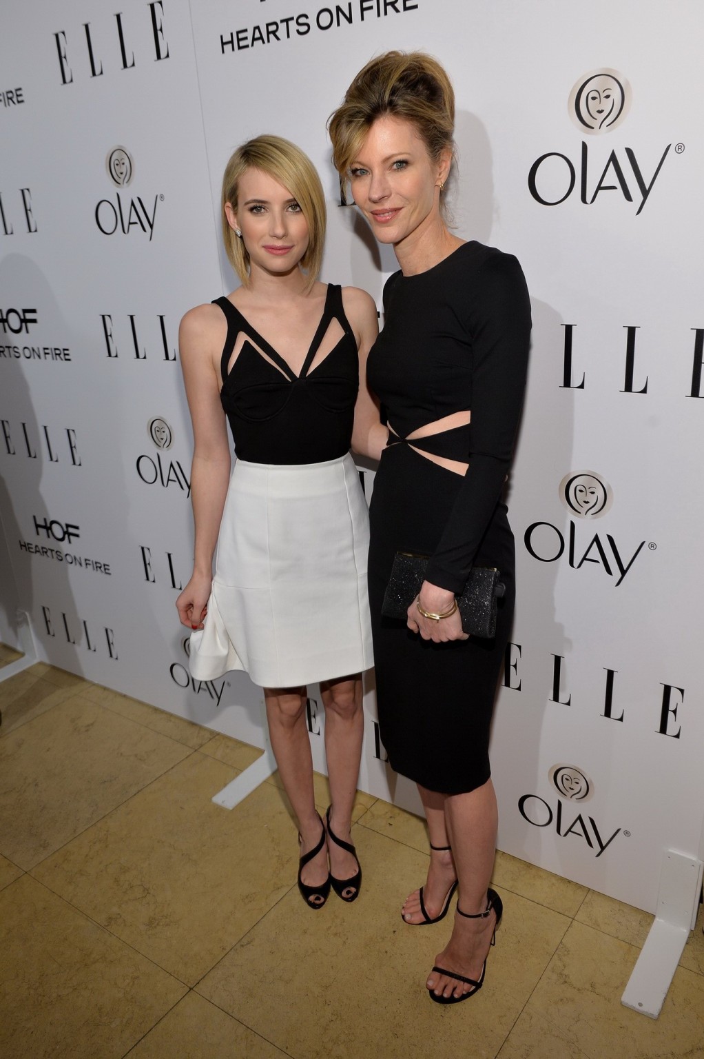 Emma Roberts cleavy and leggy in a skimpy top and short skirt at ELLE's Women in #75206373