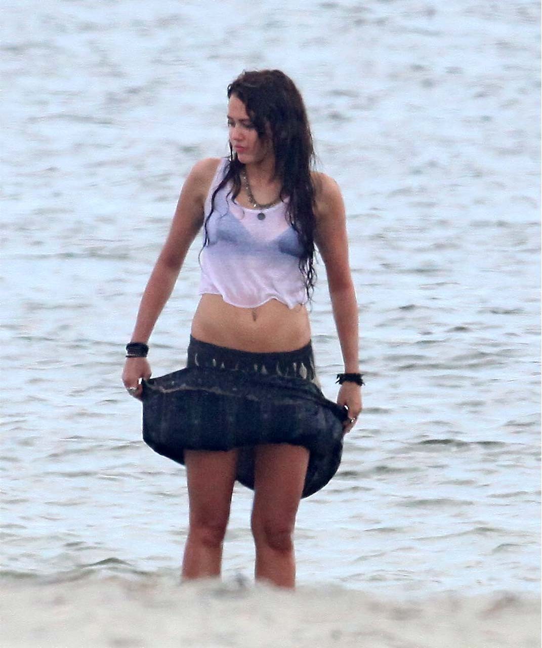 Miley Cyrus exposing her sexy body and nice boobs in wet clothes #75314543