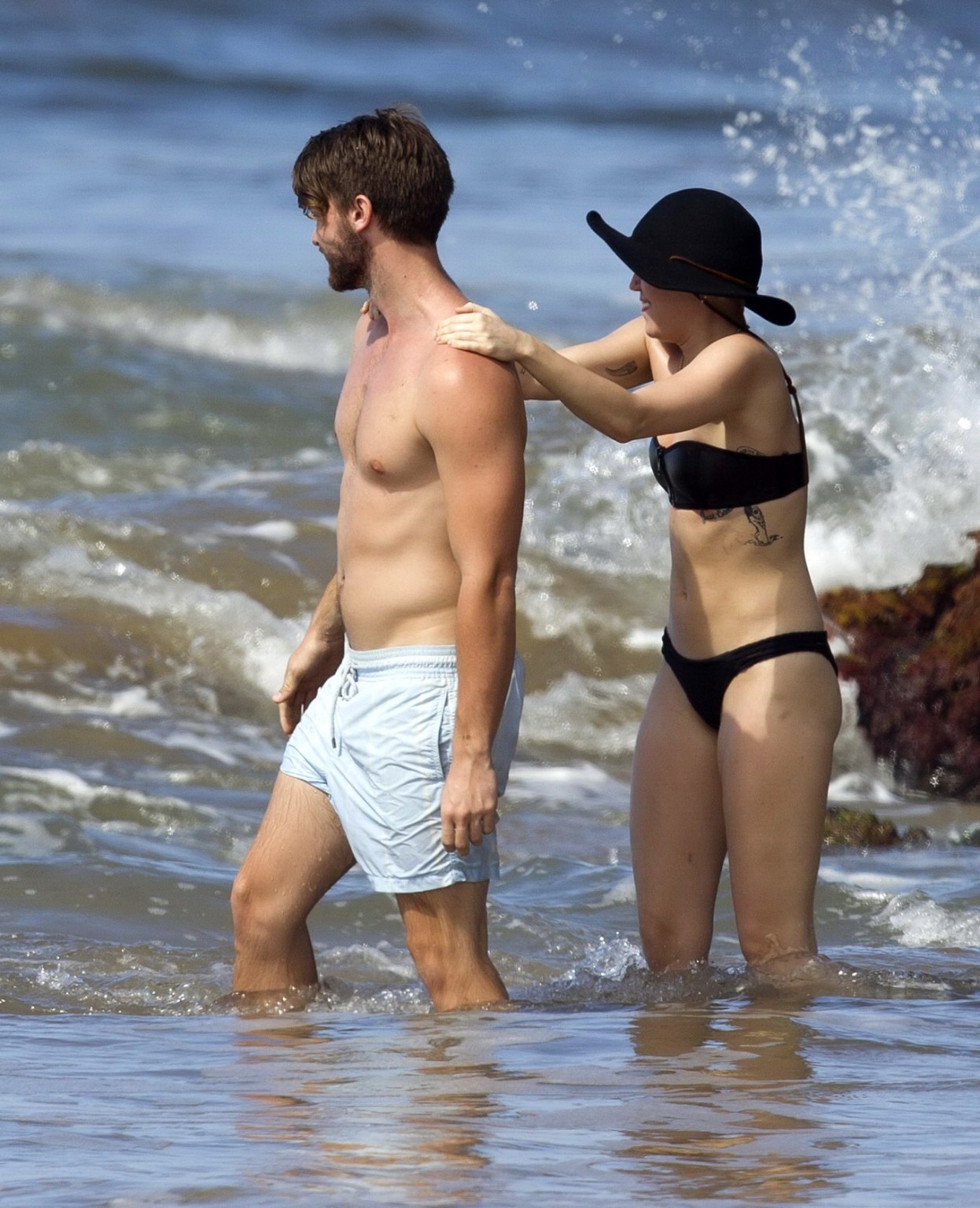 Miley Cyrus showing off her bikini body and getting her ass groped on a Hawaiian #75175182