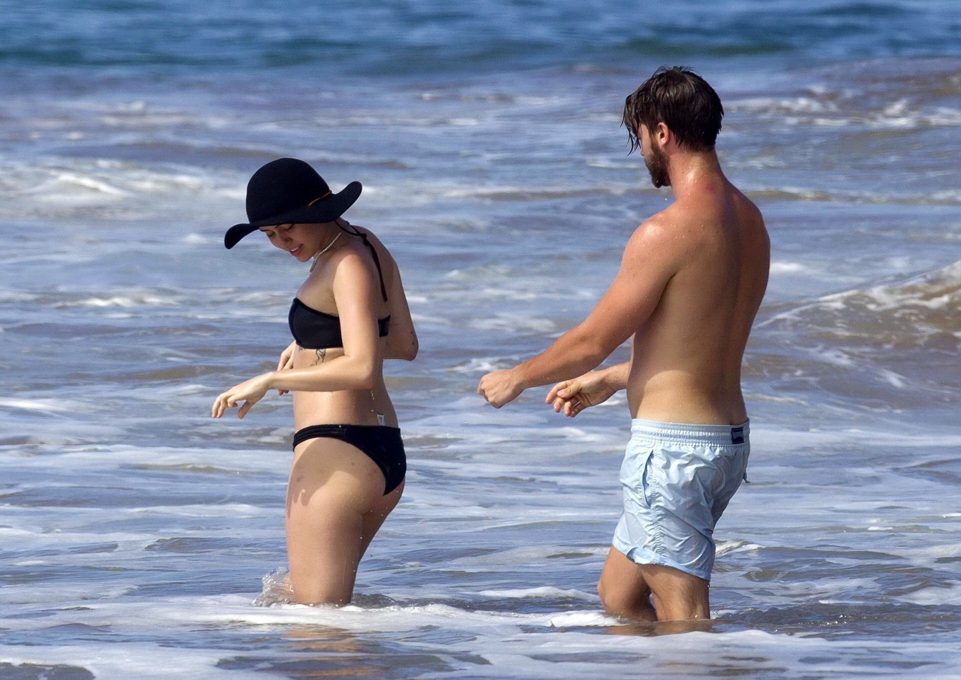 Miley Cyrus showing off her bikini body and getting her ass groped on a Hawaiian #75175214