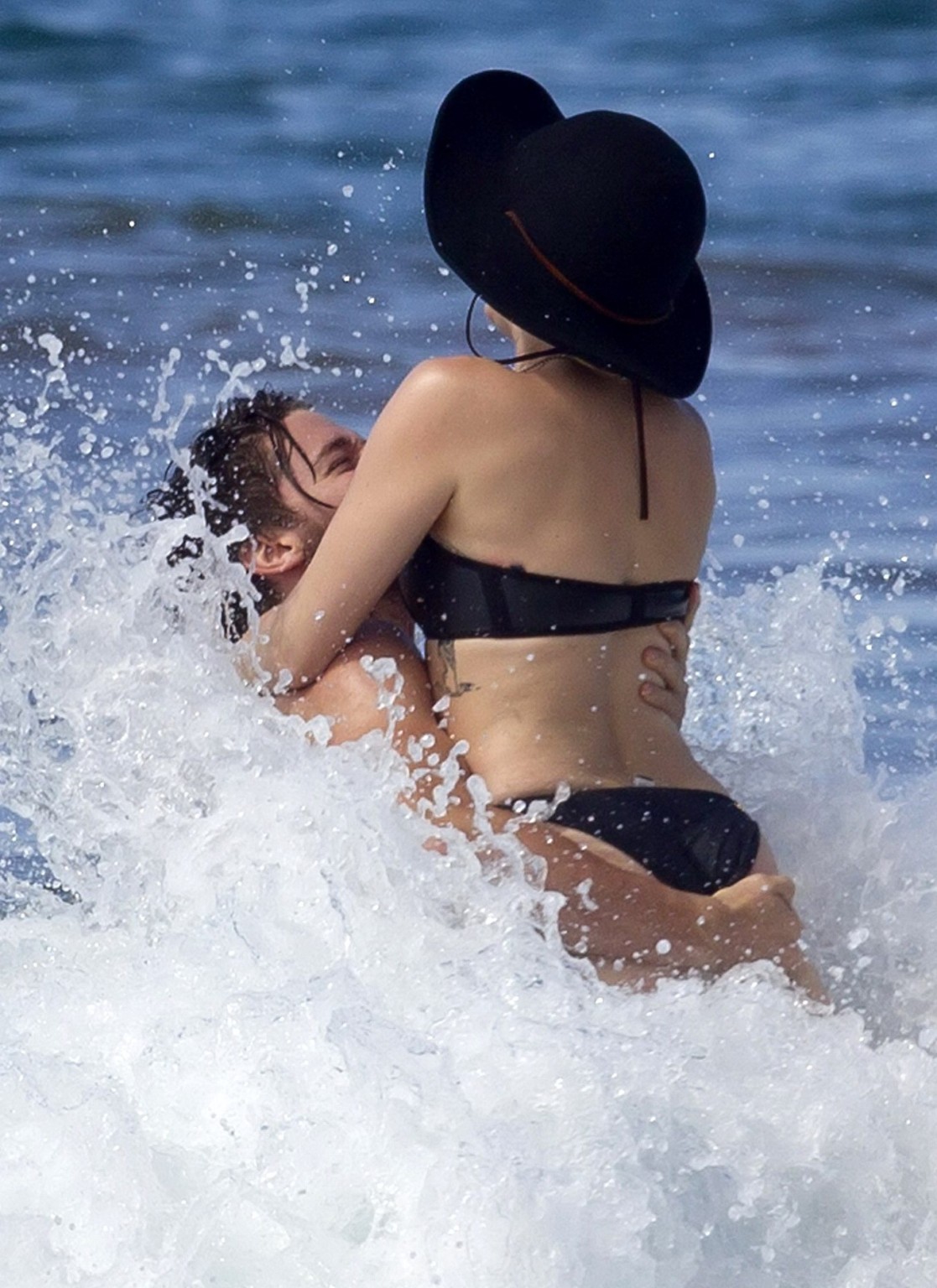 Miley Cyrus showing off her bikini body and getting her ass groped on a Hawaiian #75175240