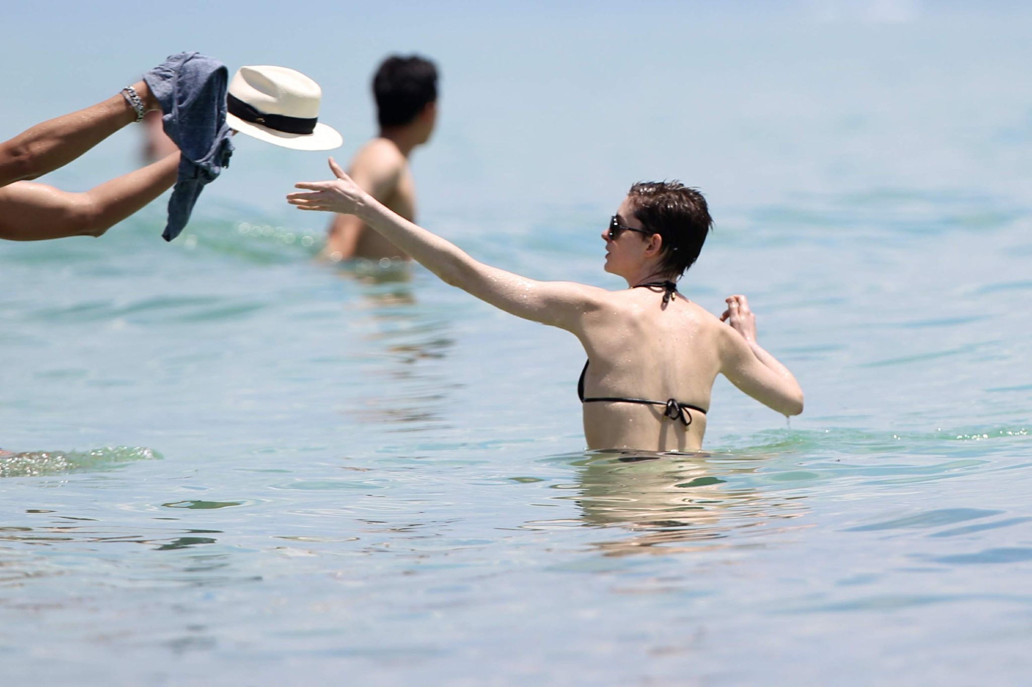 Anne Hathaway wearing a sexy black bikini on a beach in Miami #75263467