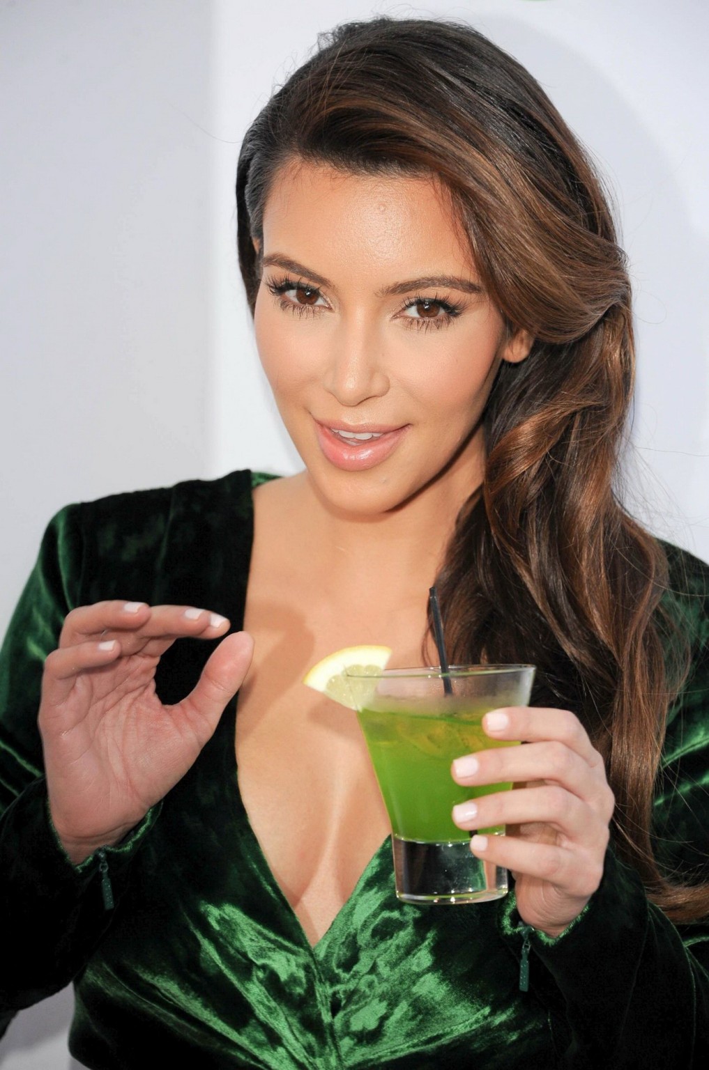 Kim Kardashian shows huge cleavage wearing green high slit dress at Midori Makeo #75251743