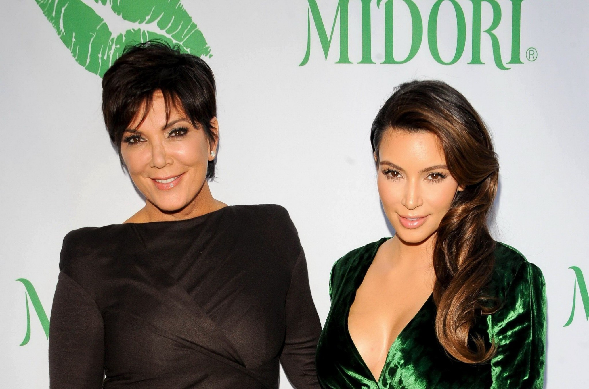 Kim Kardashian shows huge cleavage wearing green high slit dress at Midori Makeo #75251771