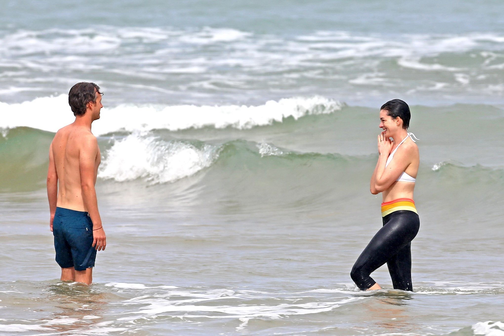 Anne Hathaway showing pokies in wet bikini tops on a Hawaiian beach #75206990