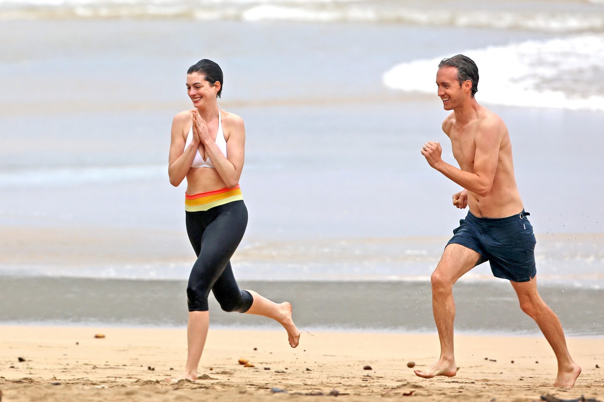 Anne Hathaway showing pokies in wet bikini tops on a Hawaiian beach #75207012